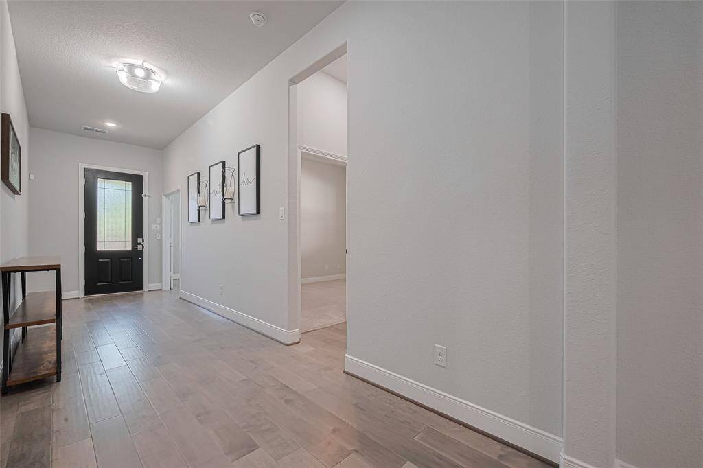 Enter to gorgeous wood floors though all living areas , designer paint and modern fixtures