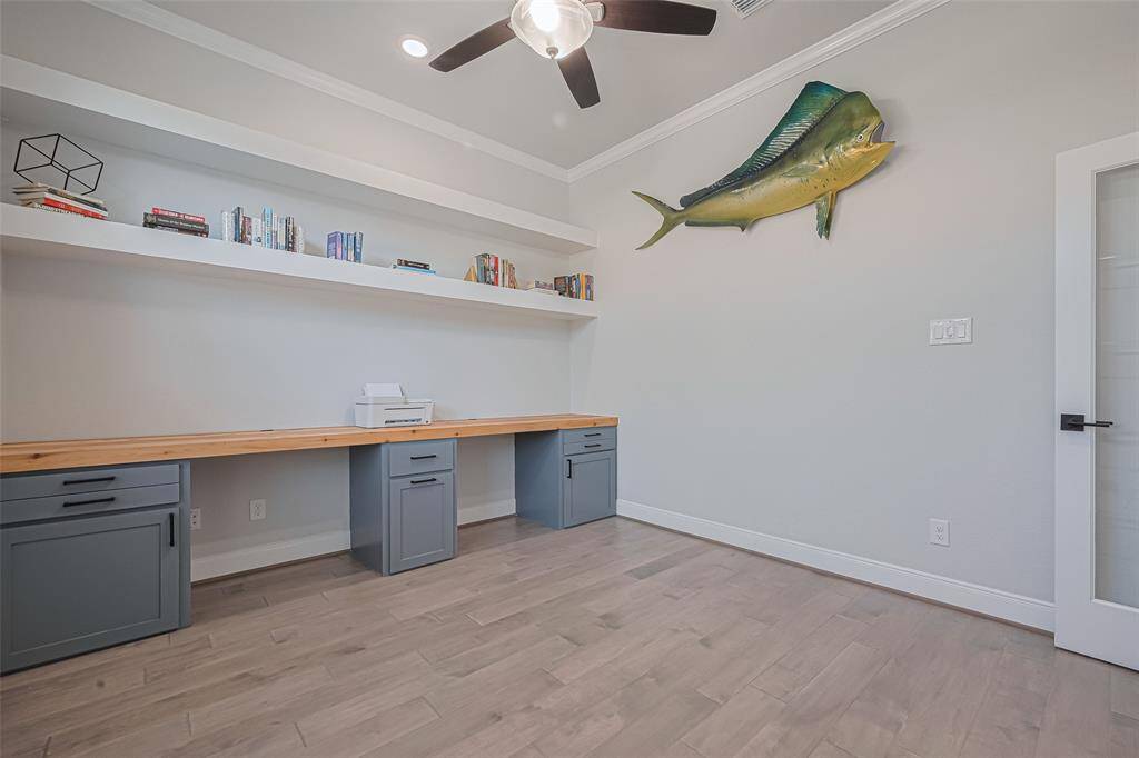PRIVATE STUDY with double glass door and custom built in cabinetry desk area