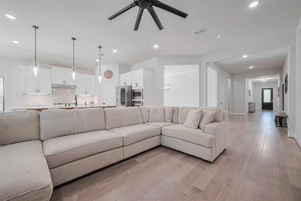 Here is where you live you life and live it well!  Great space open to the kitchen