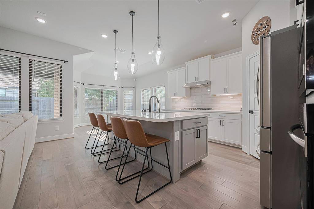 Huge central island kitchen with breakfast seating