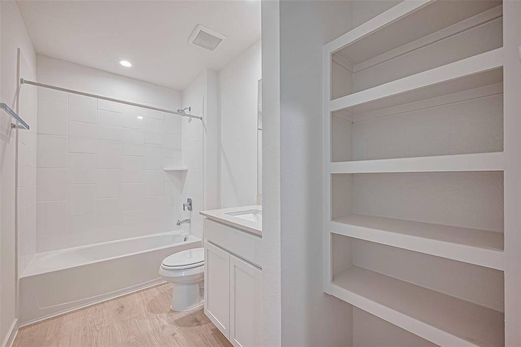 Lots of shelving inside the bathroom