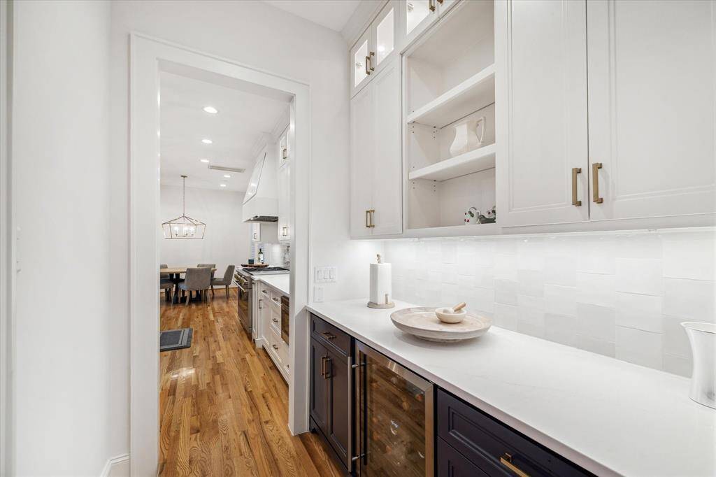 Butlers pantry provides extra storage and includes a beverage fridge