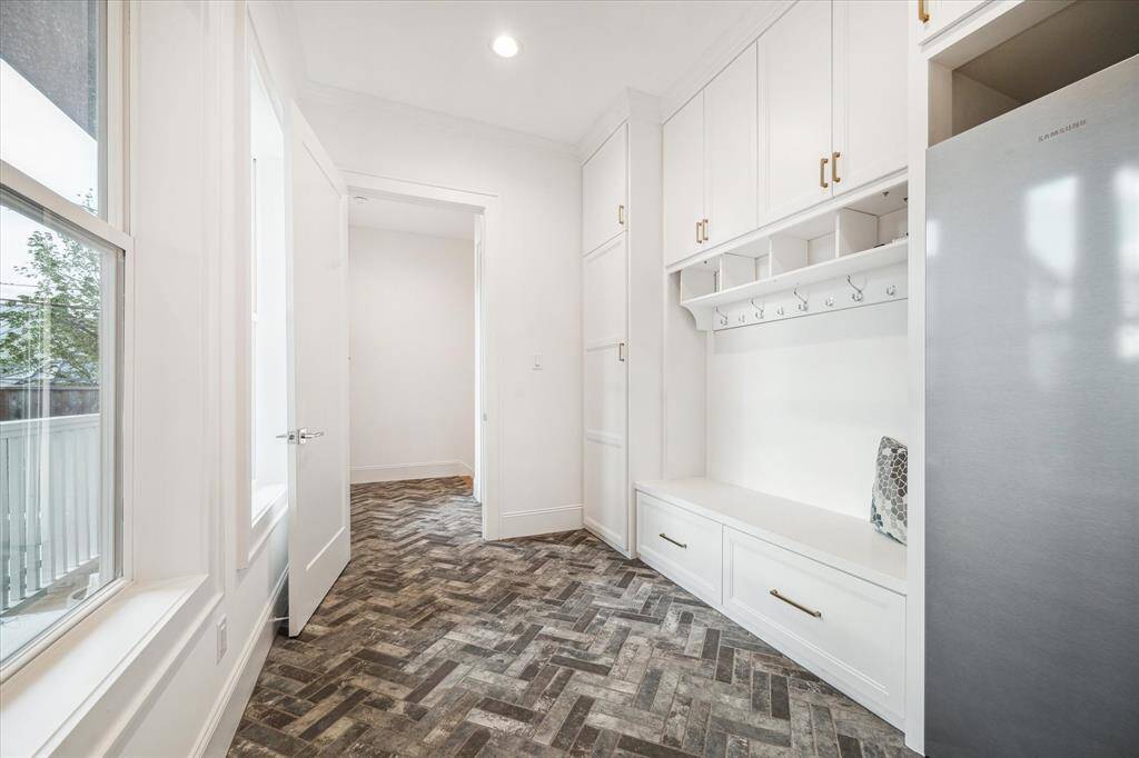 Mud room with custom flooring, built-ins