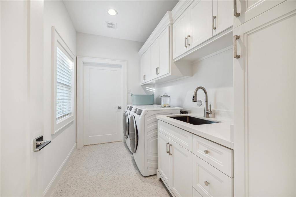 Laundry room conveniently located central to all bedrooms