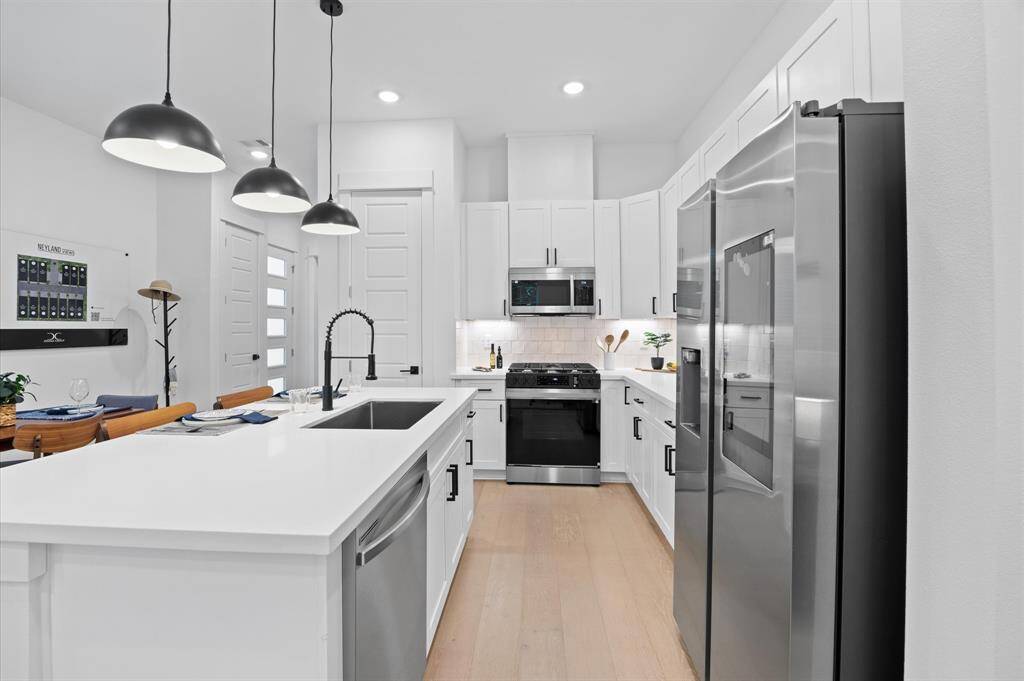 Beautiful kitchen island with plenty of space for food prep and extra sitting area.