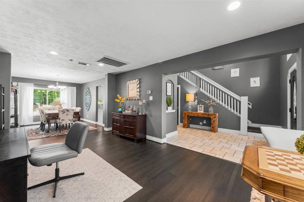 Formal living is a great optional space for an office. LVP installed in 2025.
