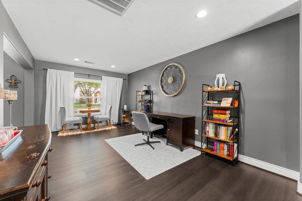 View of the formal living room with gorgeous colors. Ceilings painted2025.