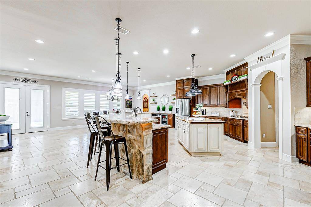 This kitchen is truly a chef's dream, thoughtfully designed to offer every luxury imaginable. With generous counter space, abundant storage, and top-of-the-line appliances, it provides the perfect setting for everything from everyday meal prep to hosting gourmet dinner parties with ease and elegance.
