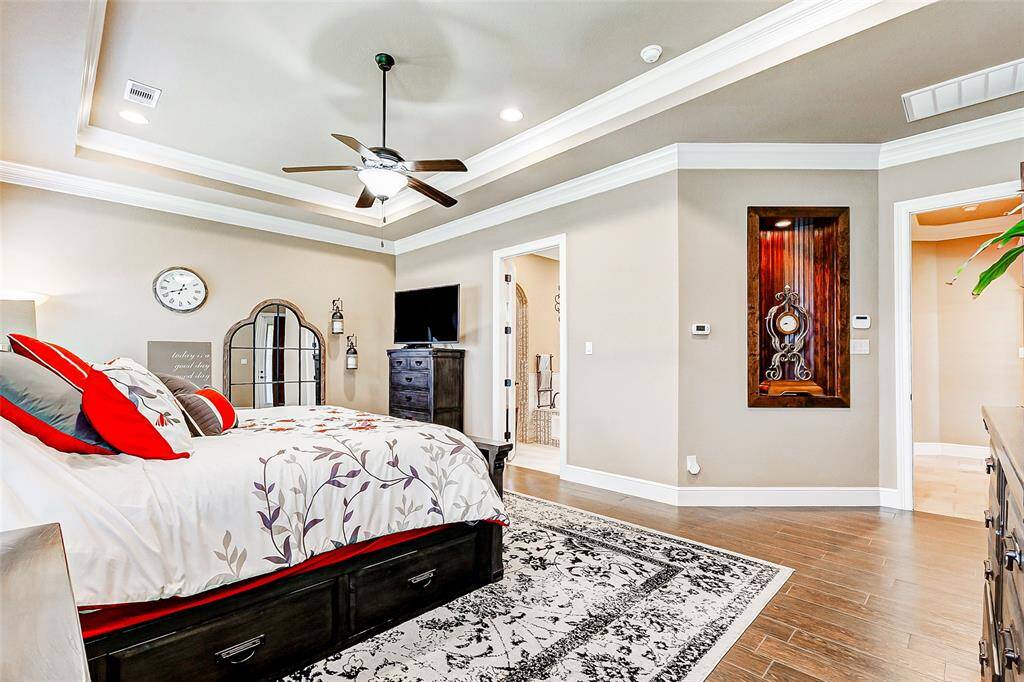 Gleaming wood-like tile floors bring warmth & richness to the space, beautifully complementing the room’s airy feel. Large windows allow natural light in, creating a bright & inviting ambiance. Best of all, the suite features a luxurious, spa-like ensuite bathroom—your own private oasis designed for ultimate relaxation & comfort.