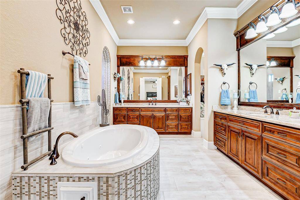 The primary ensuite bathroom offers a truly luxurious and spa-like experience, thoughtfully designed to combine comfort, style, and function.