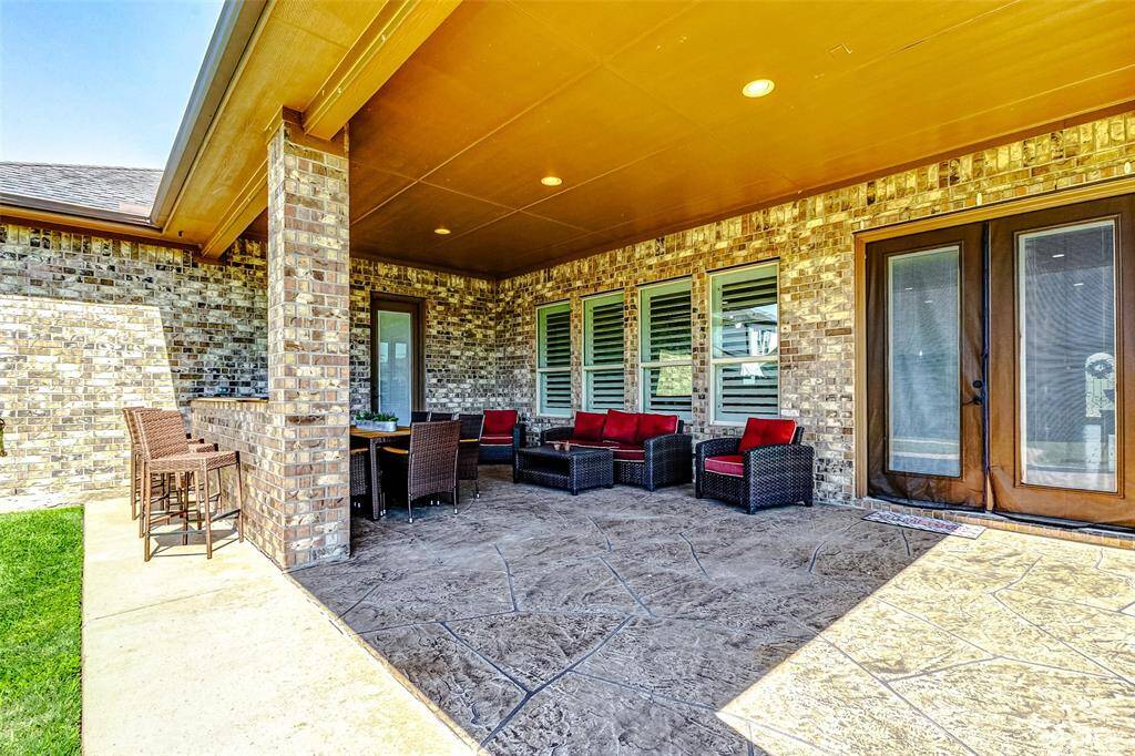 Whether you're hosting a summer barbeque or simply relaxing with a book, this outdoor oasis provides the perfect setting for year-round enjoyment.