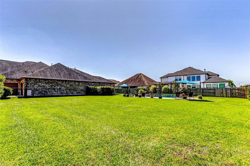 This expansive property sits on a double lot, offering plenty of space for children and pets to play safely within the secure confines of the fenced yard. Please note, due to the property being a double lot, HOA dues and fees will be assessed for each lot.