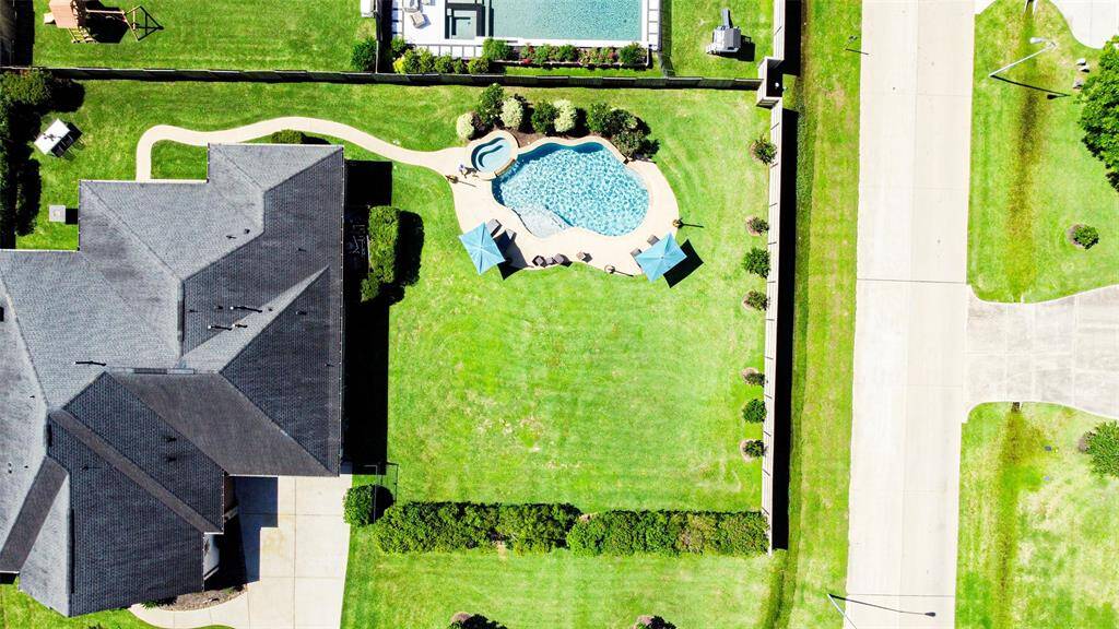 Set on an impressive DOUBLE corner lot in The Reserve at Weston Lakes, this extraordinary property must be seen to be believed.
