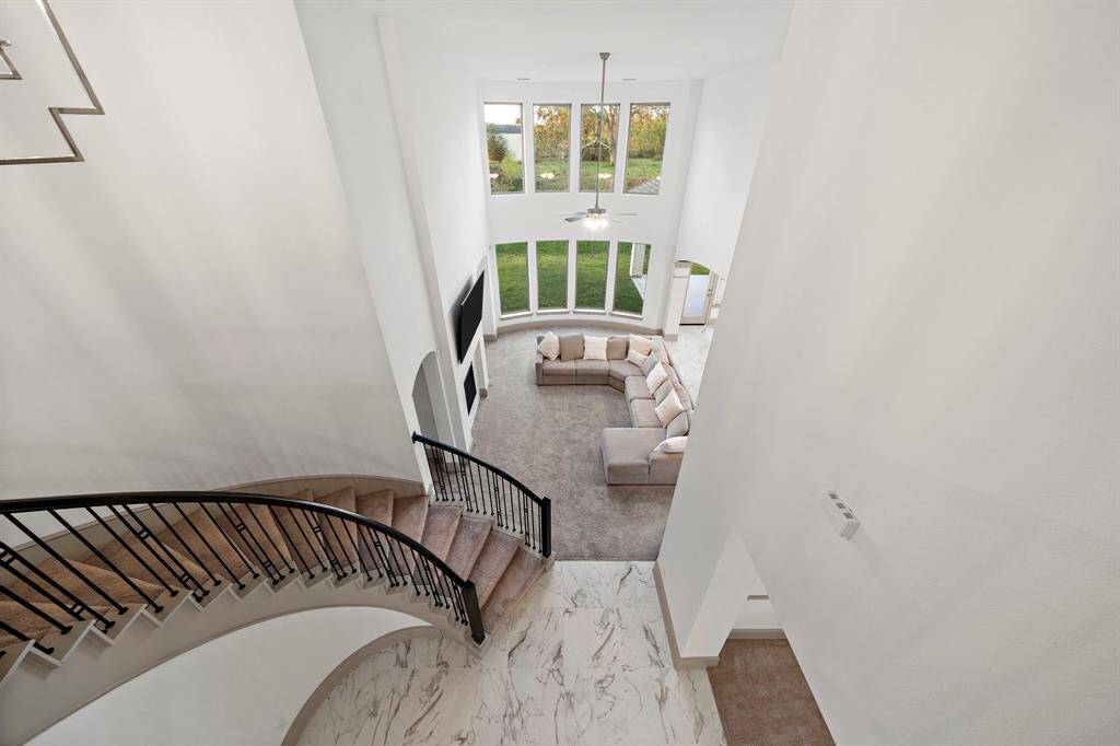 Masterfully crafted, the open-concept layout showcases the seamless flow between the entertainment spaces—ideal for large and intimate gatherings alike!