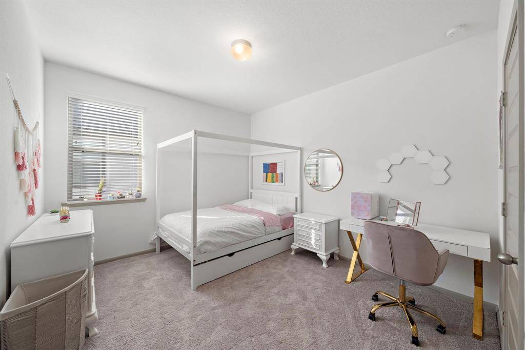 Another cozy and versatile secondary bedroom offering the perfect canvas for personalization, whether as a restful retreat or creative space.
