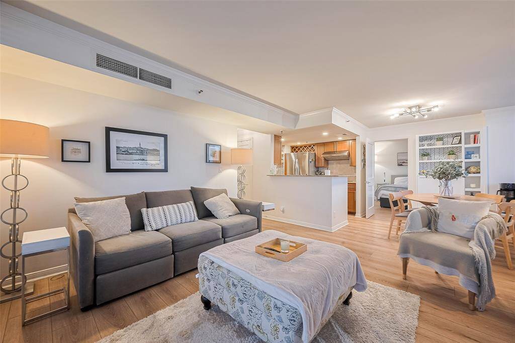 Looking toward the kitchen, there’s a hint of the hall leading to the secondary bedroom and bath.