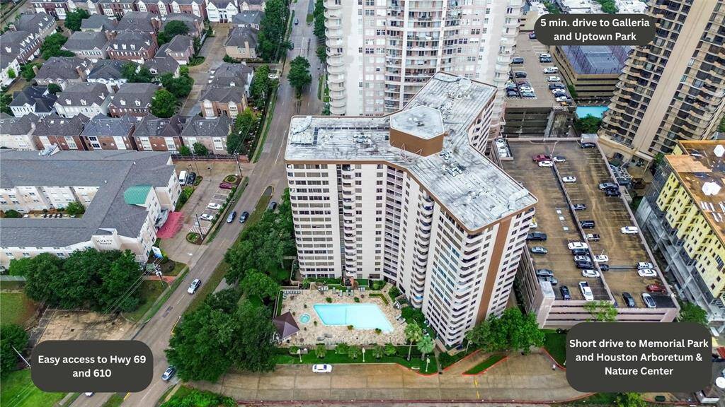 From this elevated view, see the full scope of the community, including parking, pool, and nearby buildings nestled in Houston’s urban core.