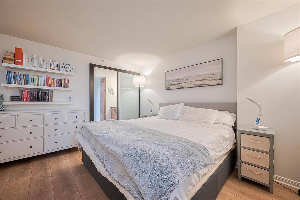 A broader perspective of the primary suite reveals its generous proportions and easy flow into the en suite bathroom.