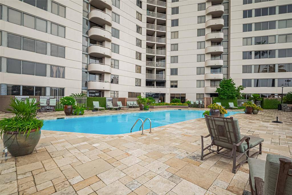 The resort-style pool area offers a refreshing escape, surrounded by lounge chairs for relaxation.