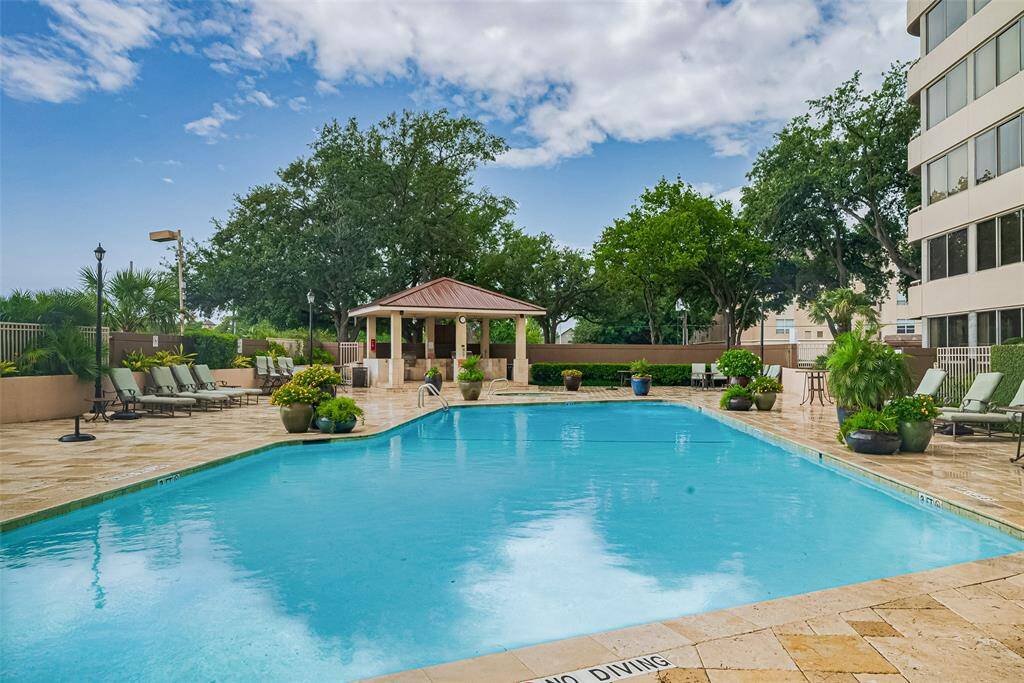 A closer view of the sparkling pool shows off its generous size and well-maintained design—perfect for soaking up the sun.