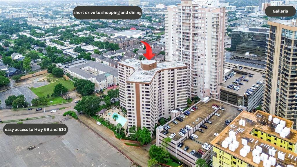 This final aerial offers a dramatic sweep over the building and beyond, putting this high-rise into stunning perspective within the city fabric.