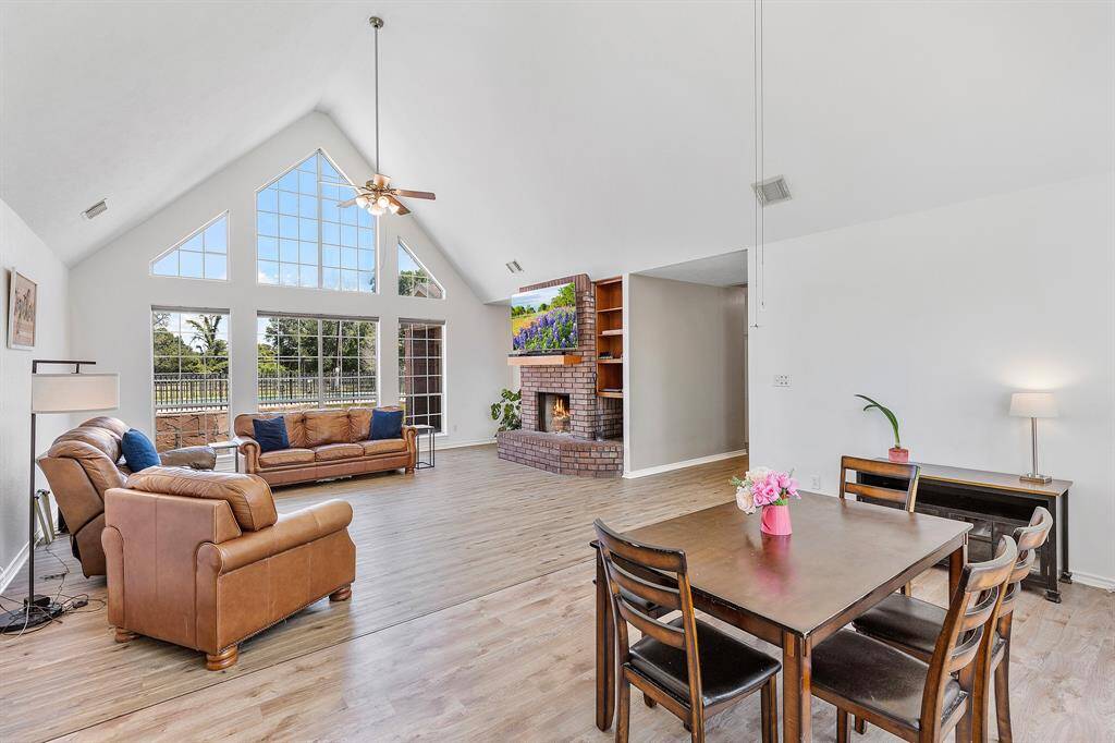The open layout includes a dining area, perfect for gatherings, and modern flooring throughout.