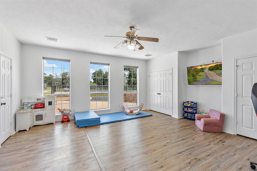 Convenient third full bathroom with shower, ideally situated near the game room and pool for easy access.