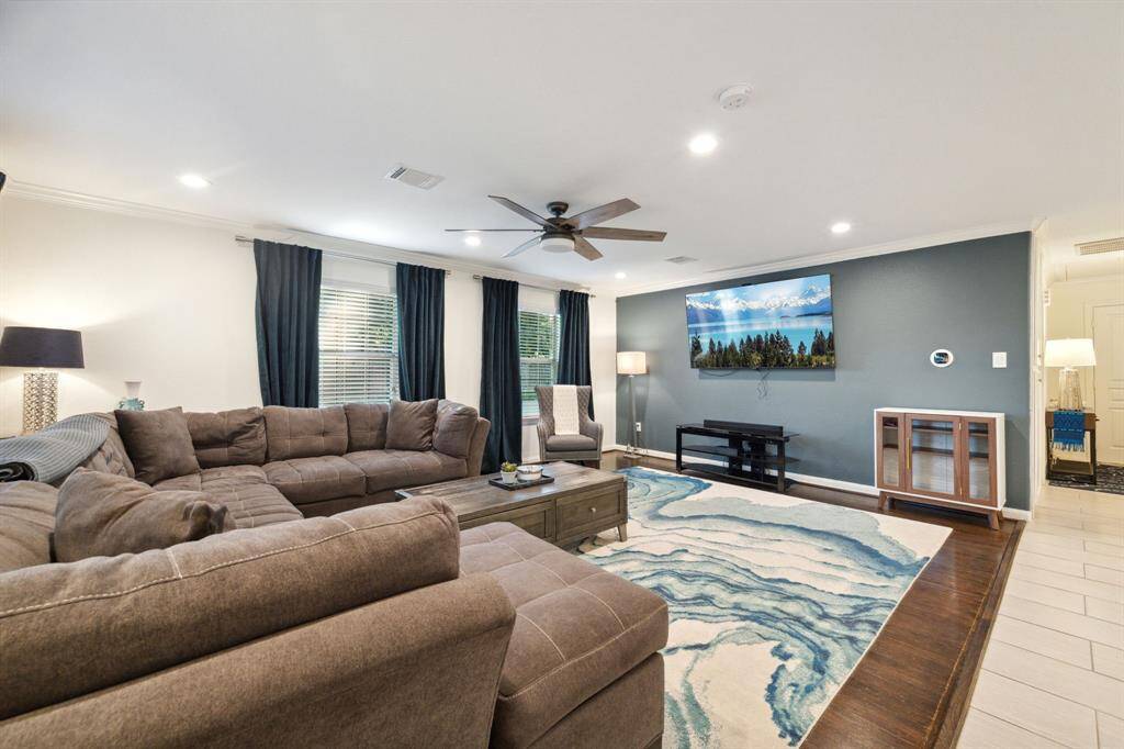 Bring on the popcorn! This setup is ready for your home theater dreams—bonus points for built-in ambiance and couch space that fits the whole crew.
