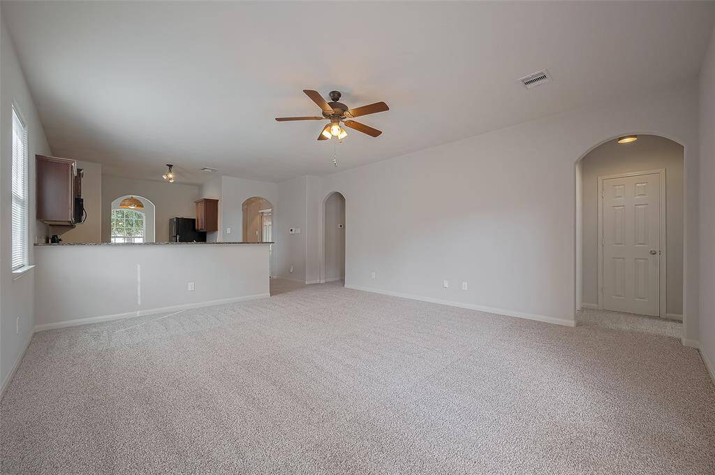another view of the living area which is open to the kitchen.