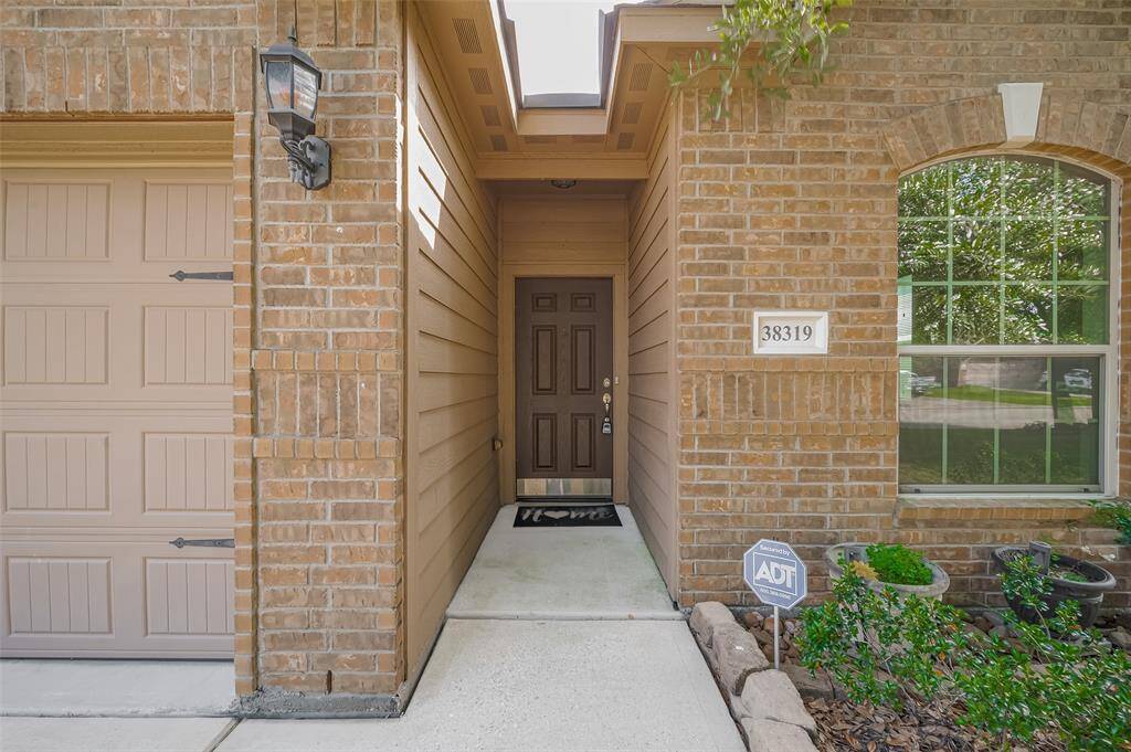 Front entrance door with brick elevation.