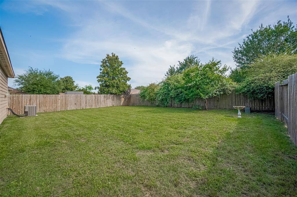 Back yard is big enough to host parties and entertain guests.