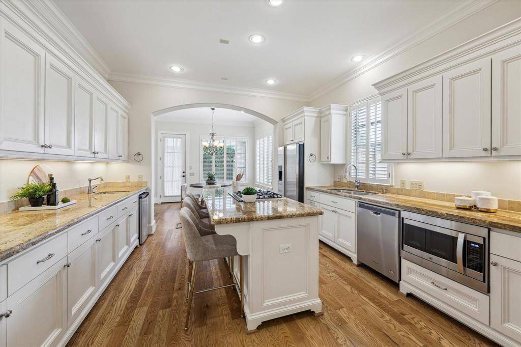 With abundant storage, the kitchen is designed to keep your countertops clear and organized.