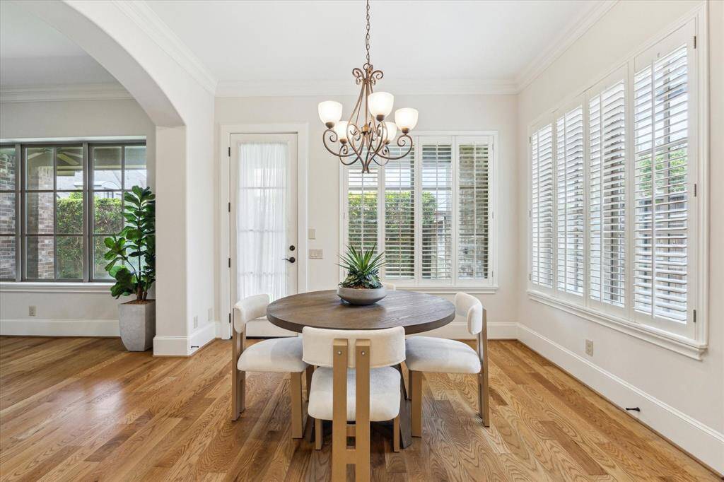Bathed in natural light from all of the windows, this inviting space provides the perfect setting for enjoying meals.