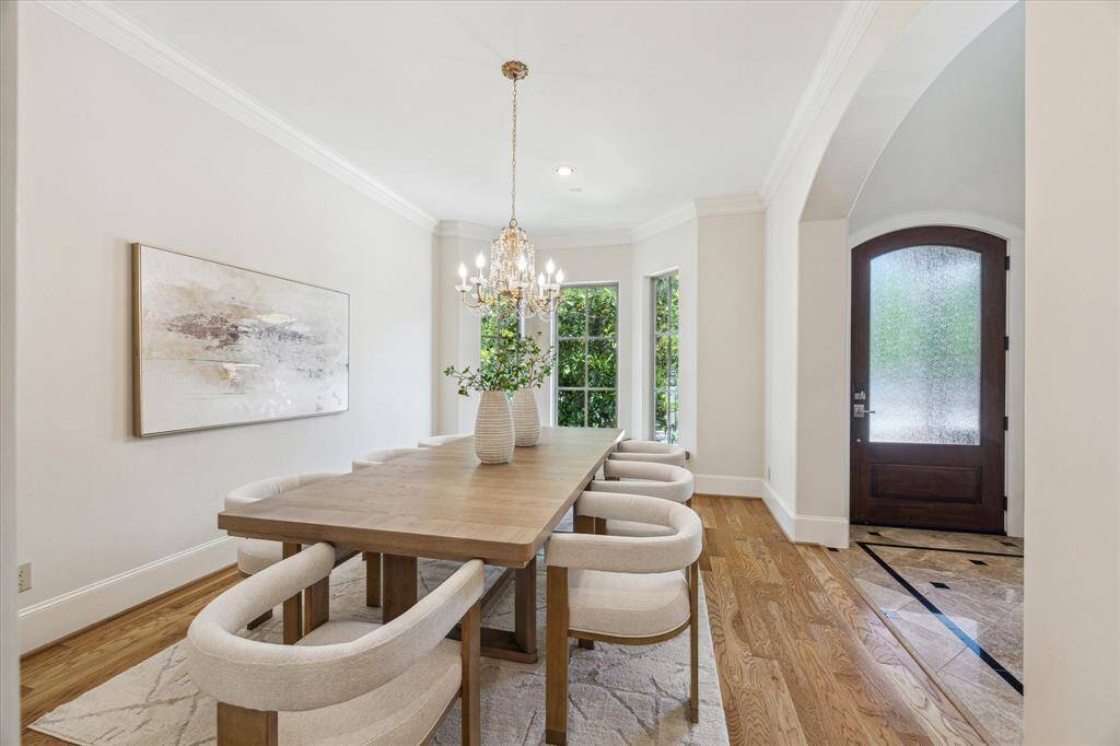 Positioned at the front of the home, the stunning dining room creates a memorable first impression for guests.