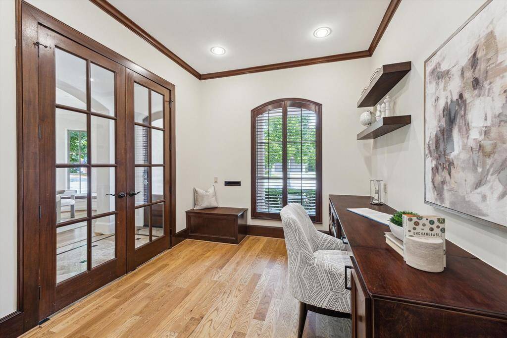 This home office is the ideal space to work while enjoying views from the window and the natural light streaming through the French doors.