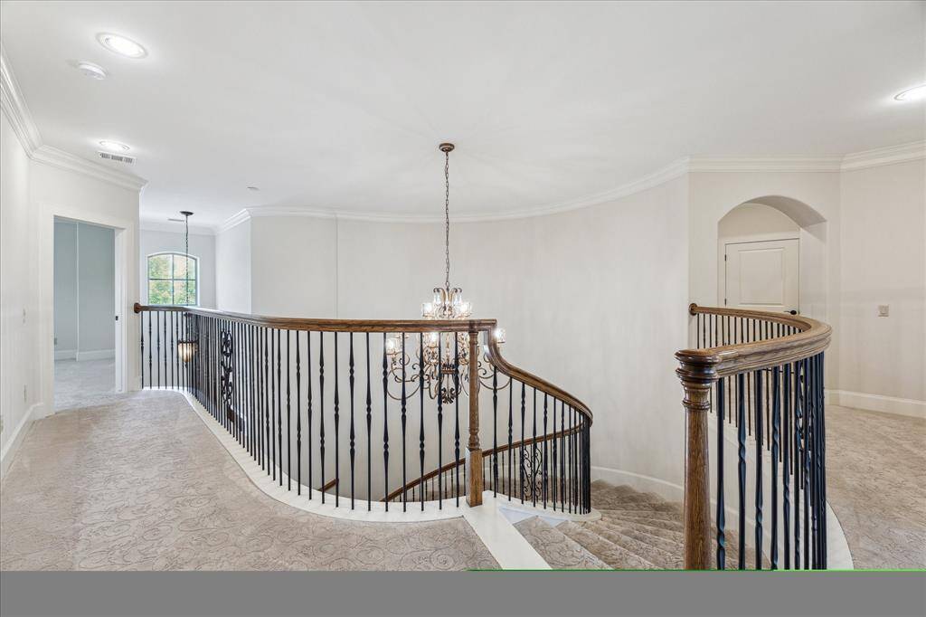 The second floor offers a well-designed layout featuring a game room, three secondary bedrooms with en-suites, a gym/flex space, and a closet built to accommodate a future elevator. Additionally, there's an unfinished attic space ready for a custom build-out.