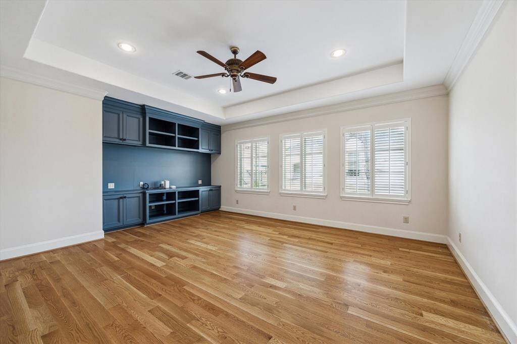 Another view of the gameroom. The wall of windows allow natural light to flood the space.