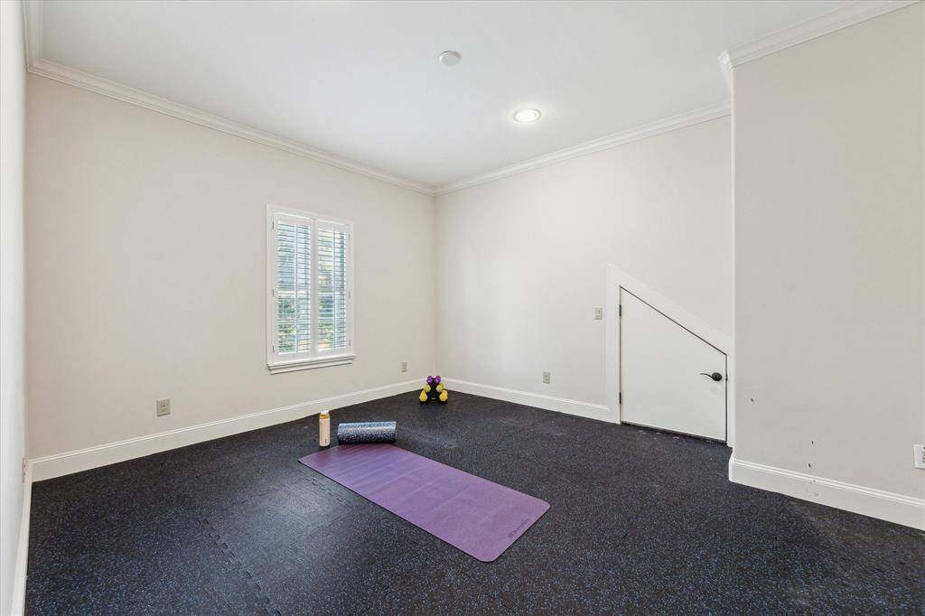 With durable rubber flooring, the flex room is an ideal space for a home gym or workout area.