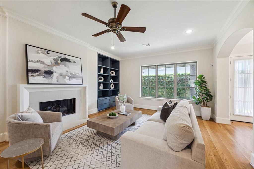 The living room overlooks the backyard and is open to the breakfast room.