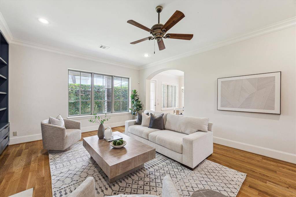 The large windows allow natural light to flood the room.