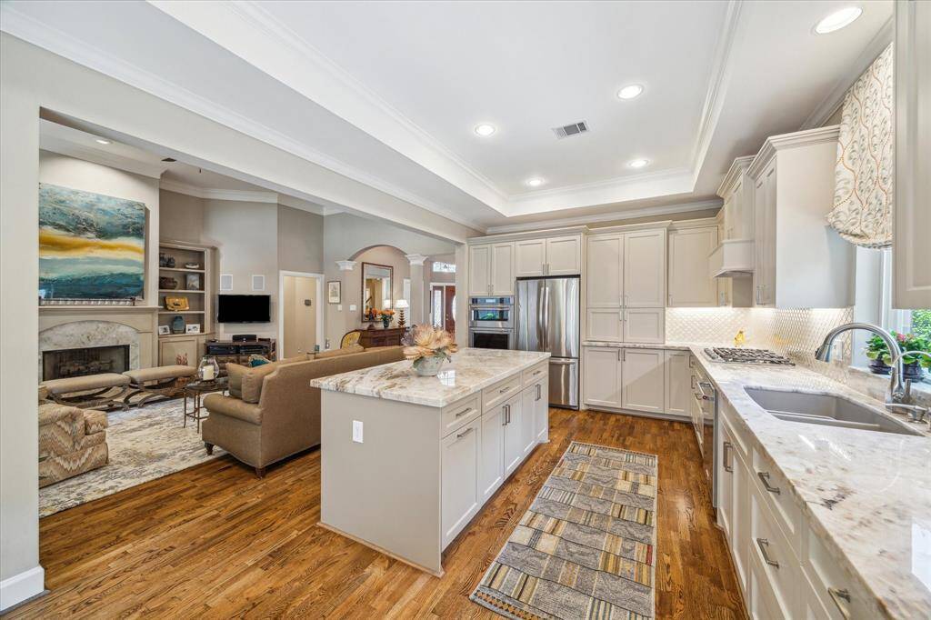 The recently remodeled kitchen has ia large island,numerous drawers, gas cooktop, filtered water faucet, undercounter lighting, and a great pantry-like cabinet. Any chef would enjoy cooking here!