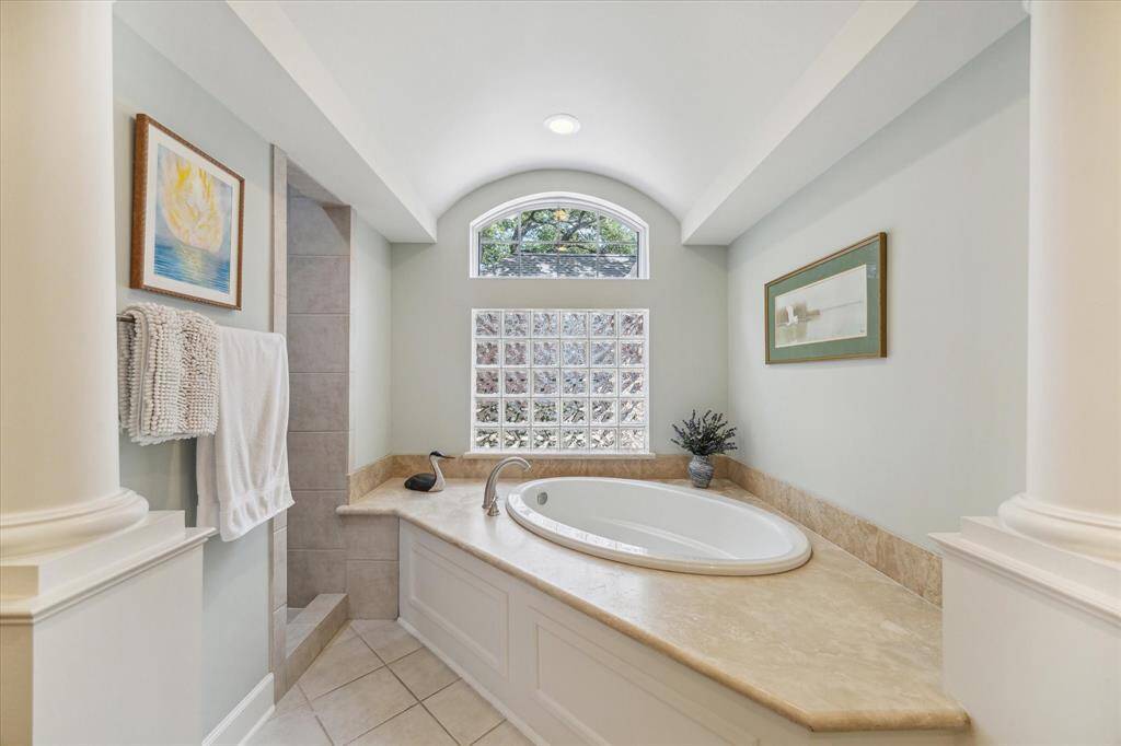 Closeup of the soaking tub area. The shower entrance is to the left.