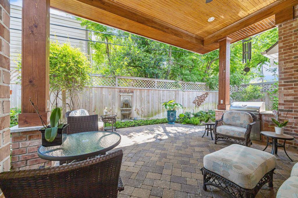Another view of the porch looking at the fountain and beautiful landscaping.