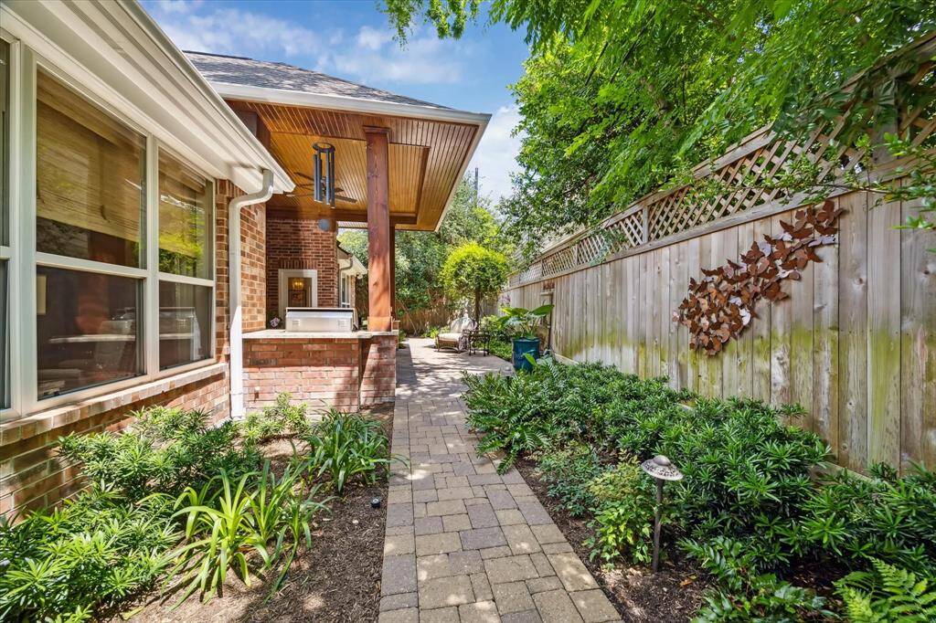 A walkway, with landscape lighting surrounds the house. The house has meticulously maintained. The roof was replaced in 2022.