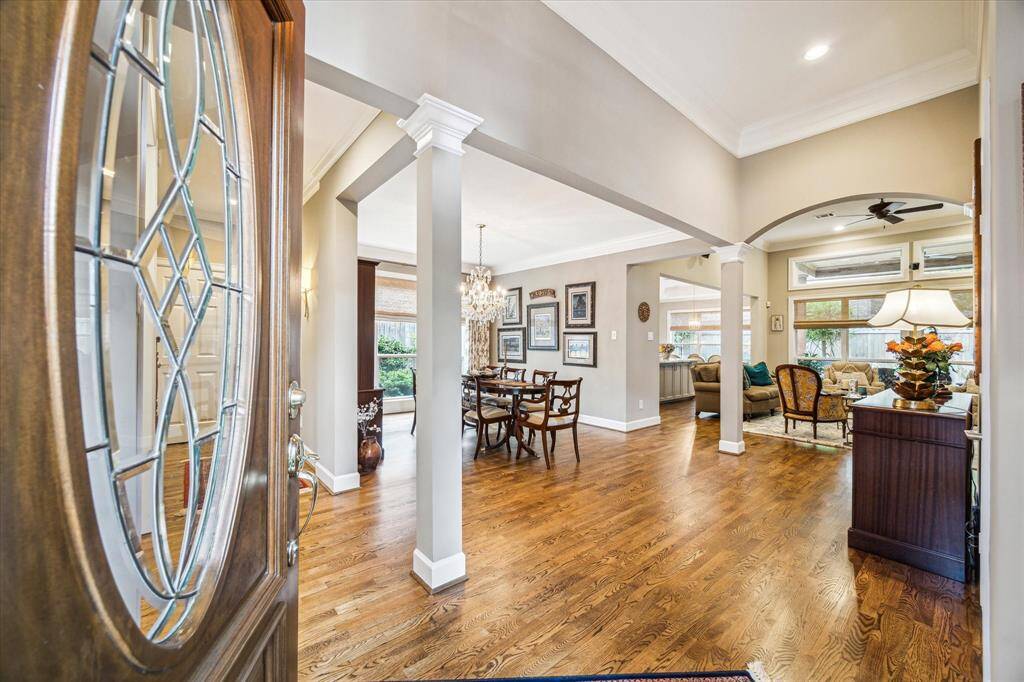A view upon entering the home. High ceilings, hardwood floors, floor to ceiling windows enhance a very open floor plan.