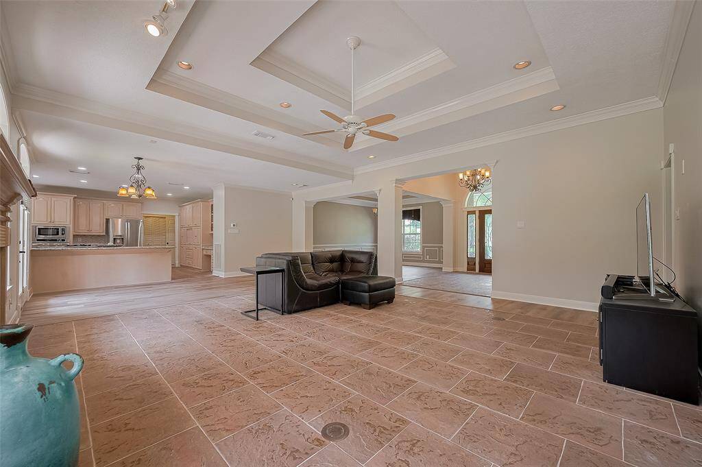 The chandelier marks the breakfast area space. What a fabulous home for relaxing or entertaining in style!!
