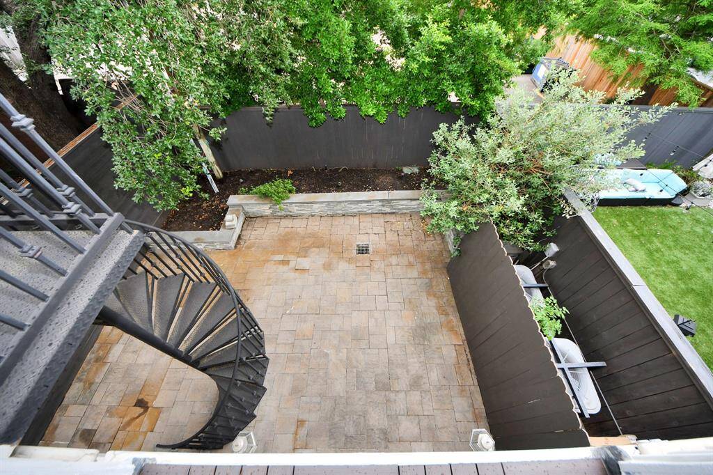 Staircase from the 2nd floor kitchen balcony leading to the back yard
