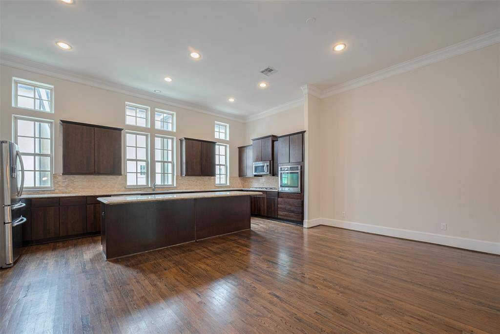 Greeted by 12 foot ceilings and that entertainer's kitchen!