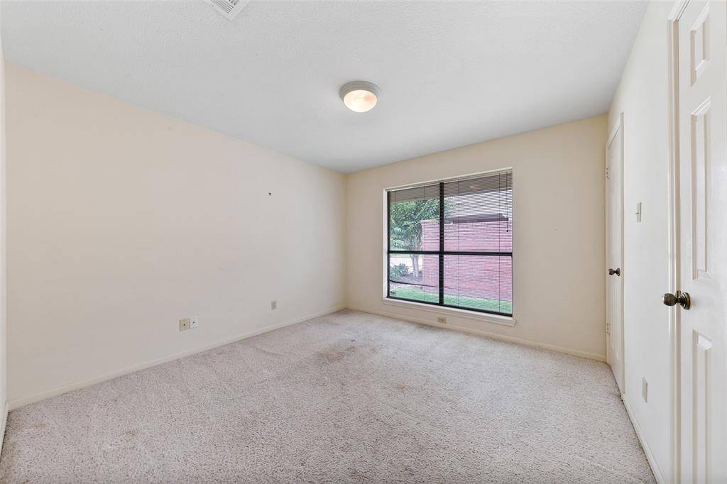 Bedroom with a large window that adds openness and outdoor views.