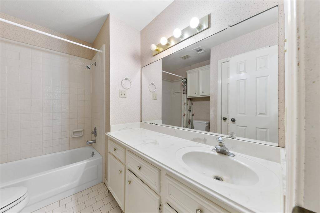 Bathroom with an extra-large vanity offering ample storage and countertop space.